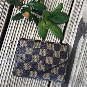 Brown checkered trifold wallet